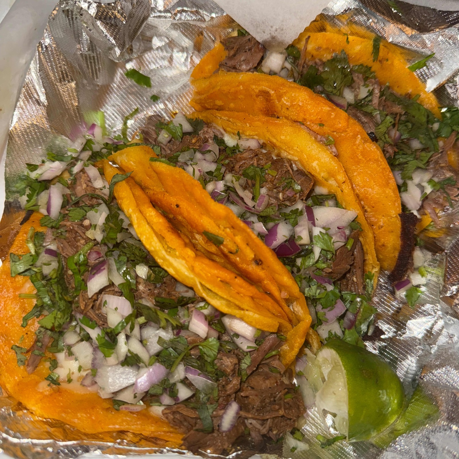 Tacos de Birria with onion and cilantro